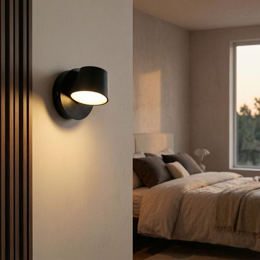 Lámpara de pared LED giratoria encendida junto a una cama